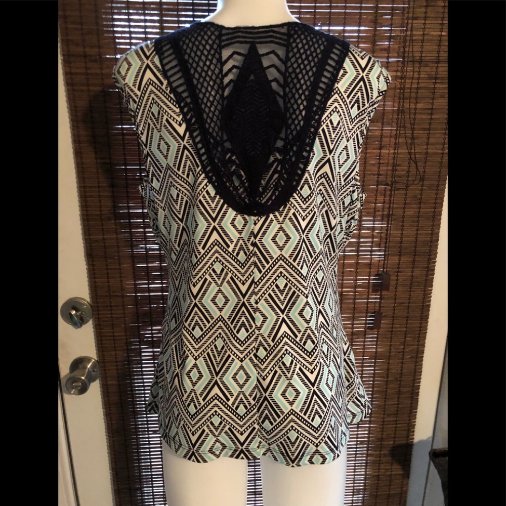 Sleeveless blouse by Alyx. Crotchet back.
